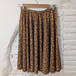 FALDA MARRÓN FLORES